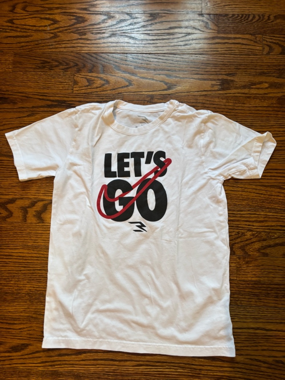 White Nike Graphic Tee with Red Swoosh youth size XL